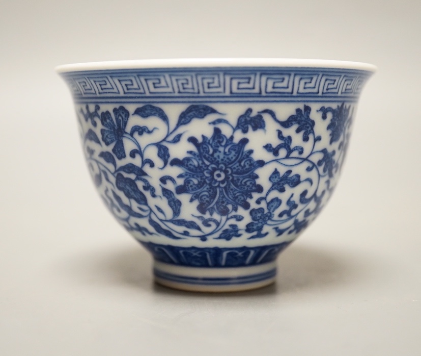 A Chinese blue and white 'lotus' cup. 9cm diameter